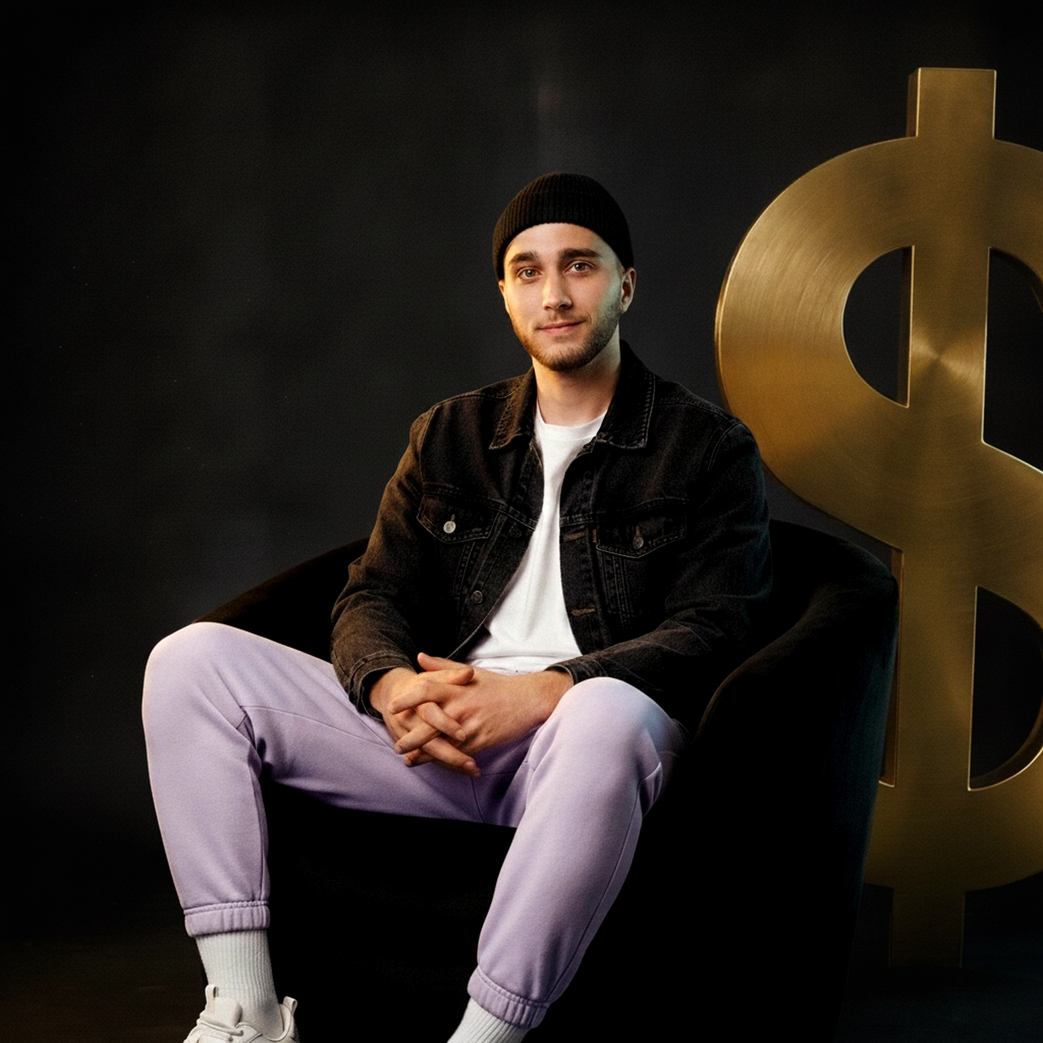 $OULJAH seated in front of a large gold dollar sign